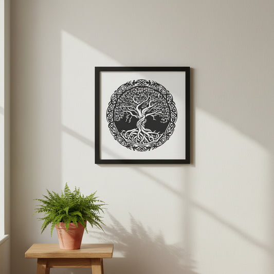 Celtic Tree of Life framed print in a black solid wood frame, hanging on a soft stone or linen-coloured wall. Natural daylight from side window, subtle shadows, minimal Irish interior styling with oak table and fern plant.