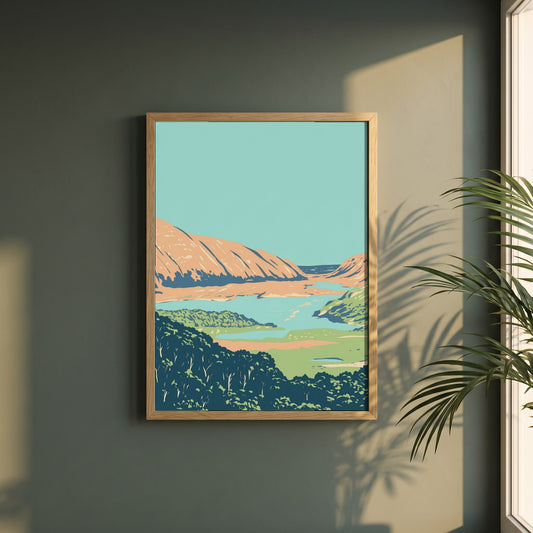 Killarney National Park County Kerry Ireland framed print in a natural oak frame on a dark green wall beside a window, dappled plant shadow