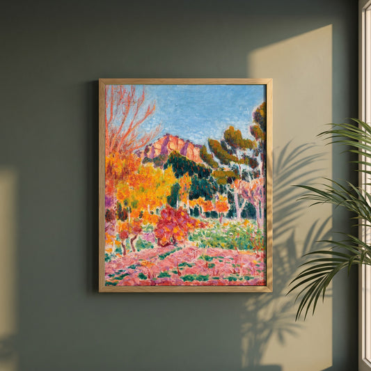 Landscape Cassis framed print in a natural oak frame on a dark green wall beside a window, dappled plant shadow