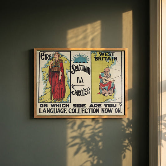 Seachtain na Gaeilge framed print in a natural oak frame on a dark green wall beside a window, dappled plant shadow