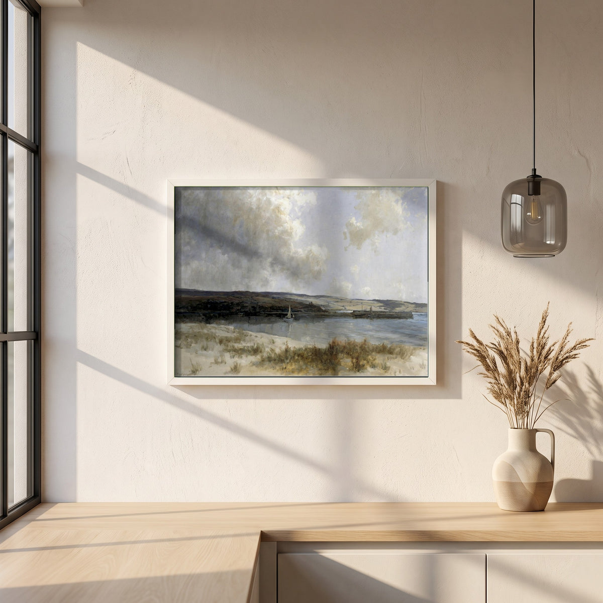 The End of the Glen framed print in a white frame on a plaster wall above an oak worktop in a bright Scandinavian kitchen