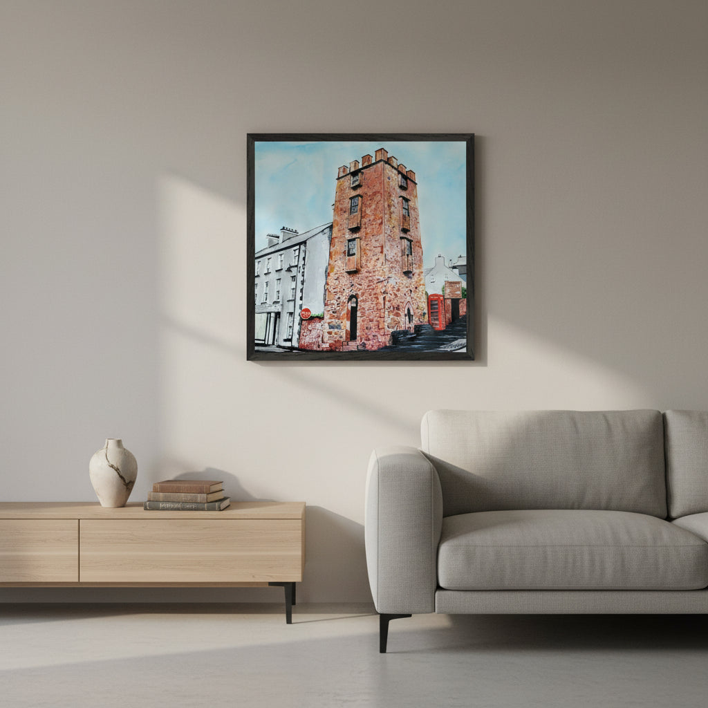 50×50 cm black-framed art print of The Curfew Tower Cushendall styled in a contemporary sitting room, matte neutral walls, luxe minimalist décor, soft morning light, crisp product-focused photography with realistic shadows.