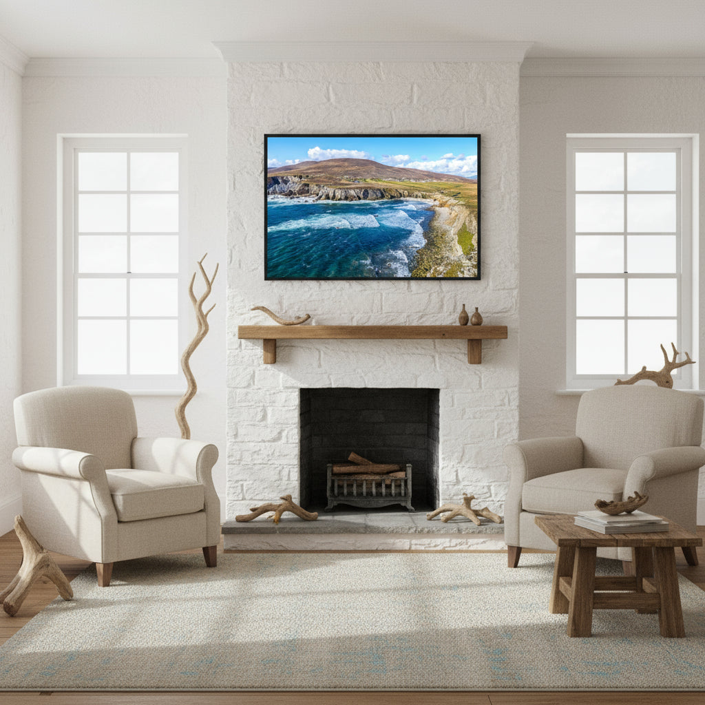 Achill Island framed print above stone fireplace in coastal Irish cottage living room