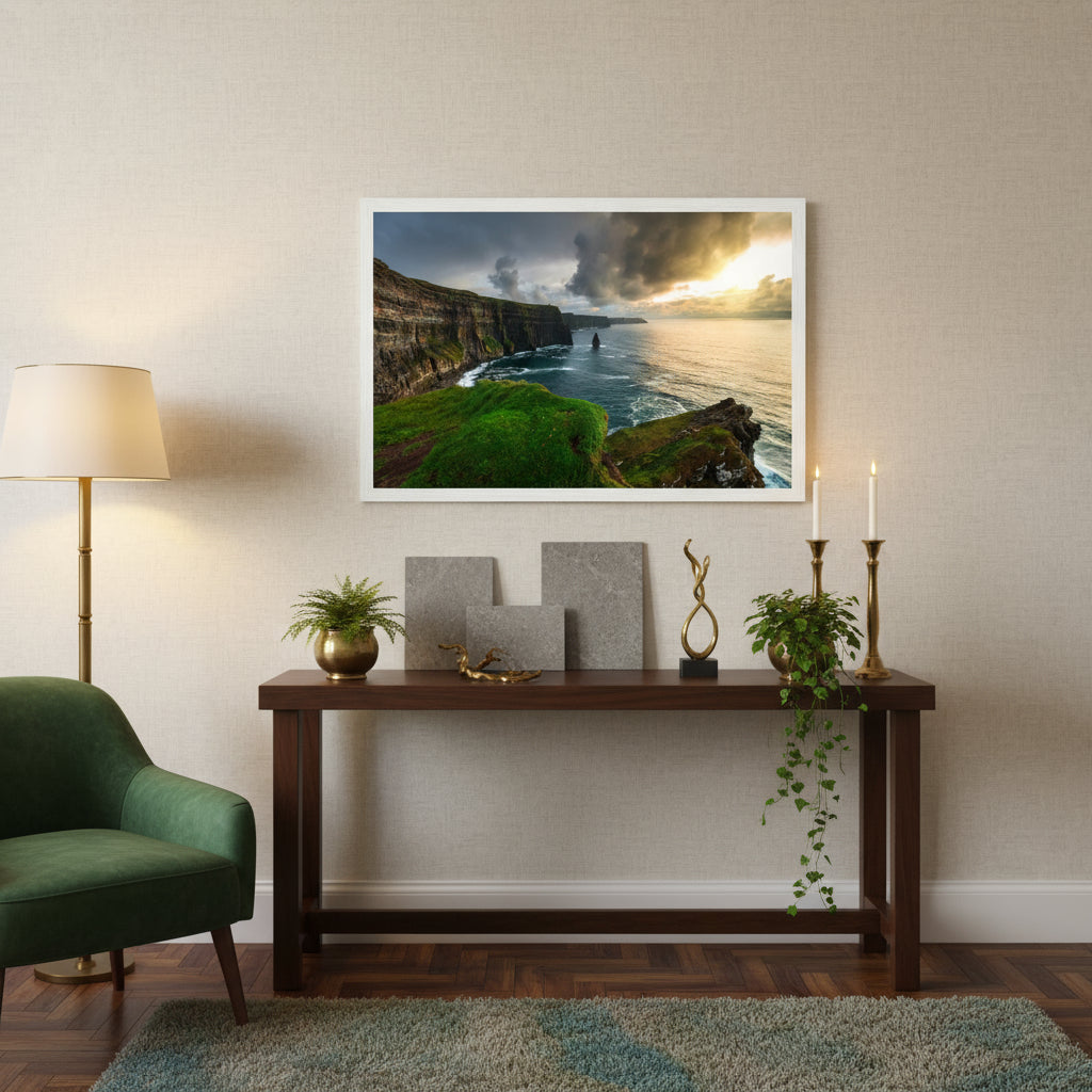 Framed Cliffs of Moher print above a console table in an Irish boutique hotel, styled with stone tiles, greenery and brass accents.