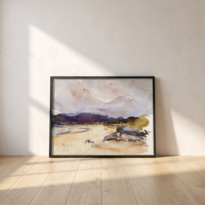 A Bay and Distant Mountains framed print in a black frame leaning against a white plaster wall on oak floorboards in morning light