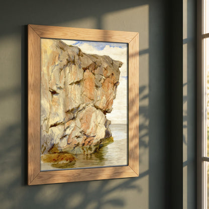 A Cliff at Howth, County Dublin framed print in a natural oak frame on a dark green wall beside a window, dappled plant shadow