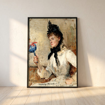 A Lady Holding a Rattle framed print in a black frame leaning against a white plaster wall on oak floorboards in morning light