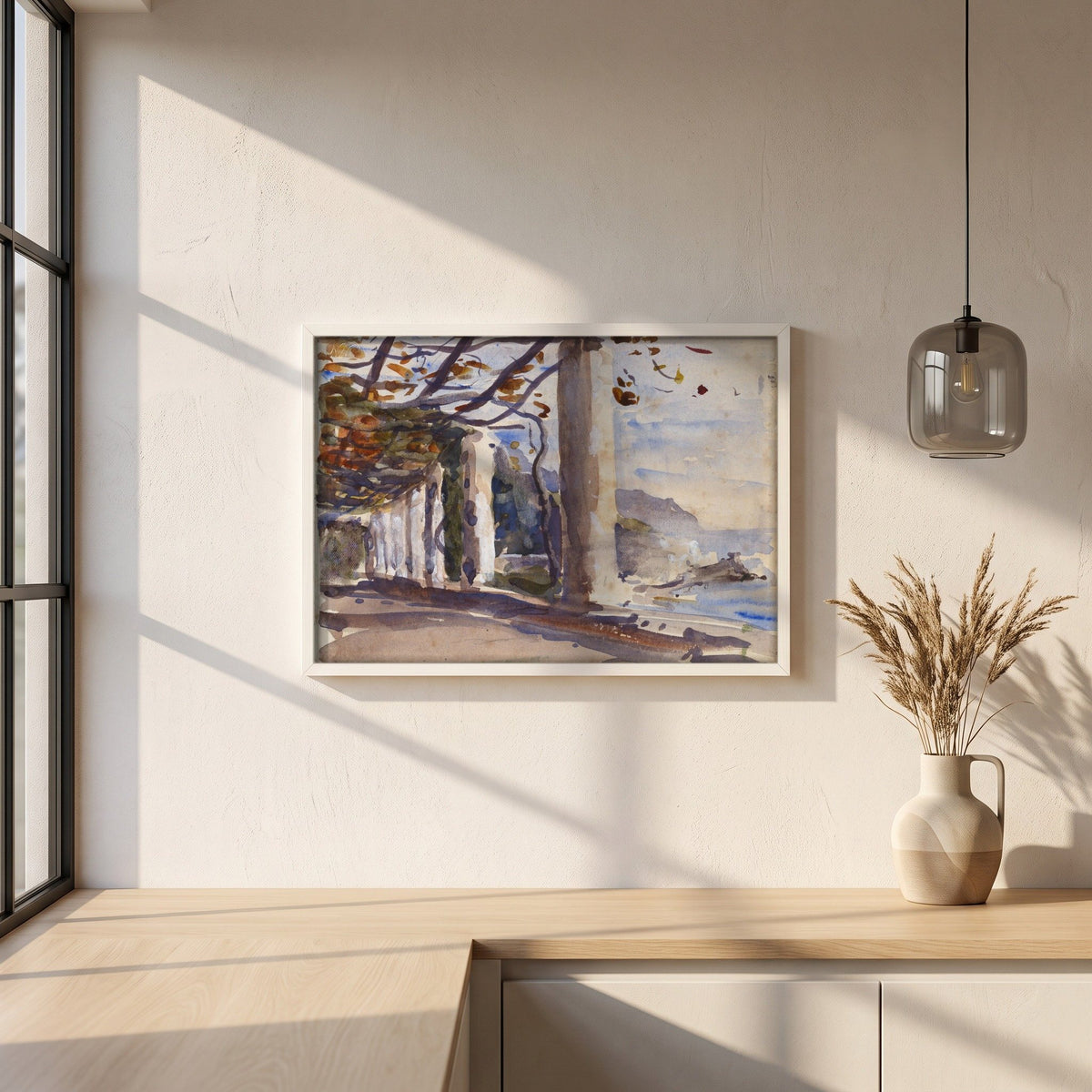 A Vine Pergola on Amalfi, Italy framed print in a white frame on a plaster wall above an oak worktop in a bright Scandinavian kitchen