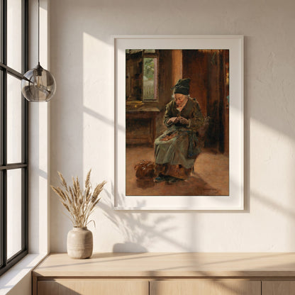An Interior of a Breton Cottage framed print in a white frame on a plaster wall above an oak worktop in a bright Scandinavian kitchen