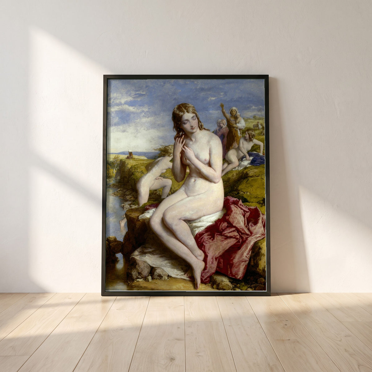Bathers Surprised framed print in a black frame leaning against a white plaster wall on oak floorboards in morning light