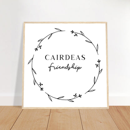 Cairdeas Friendship Irish language print in an oak frame leaning on a wooden floor