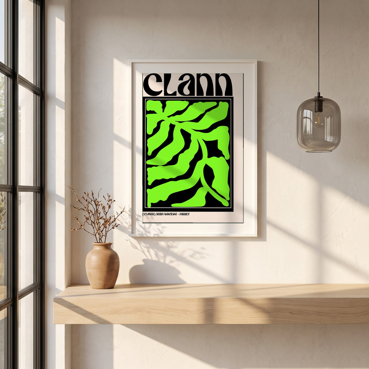 Clann framed print in a white frame on a plaster wall above an oak worktop in a bright Scandinavian kitchen