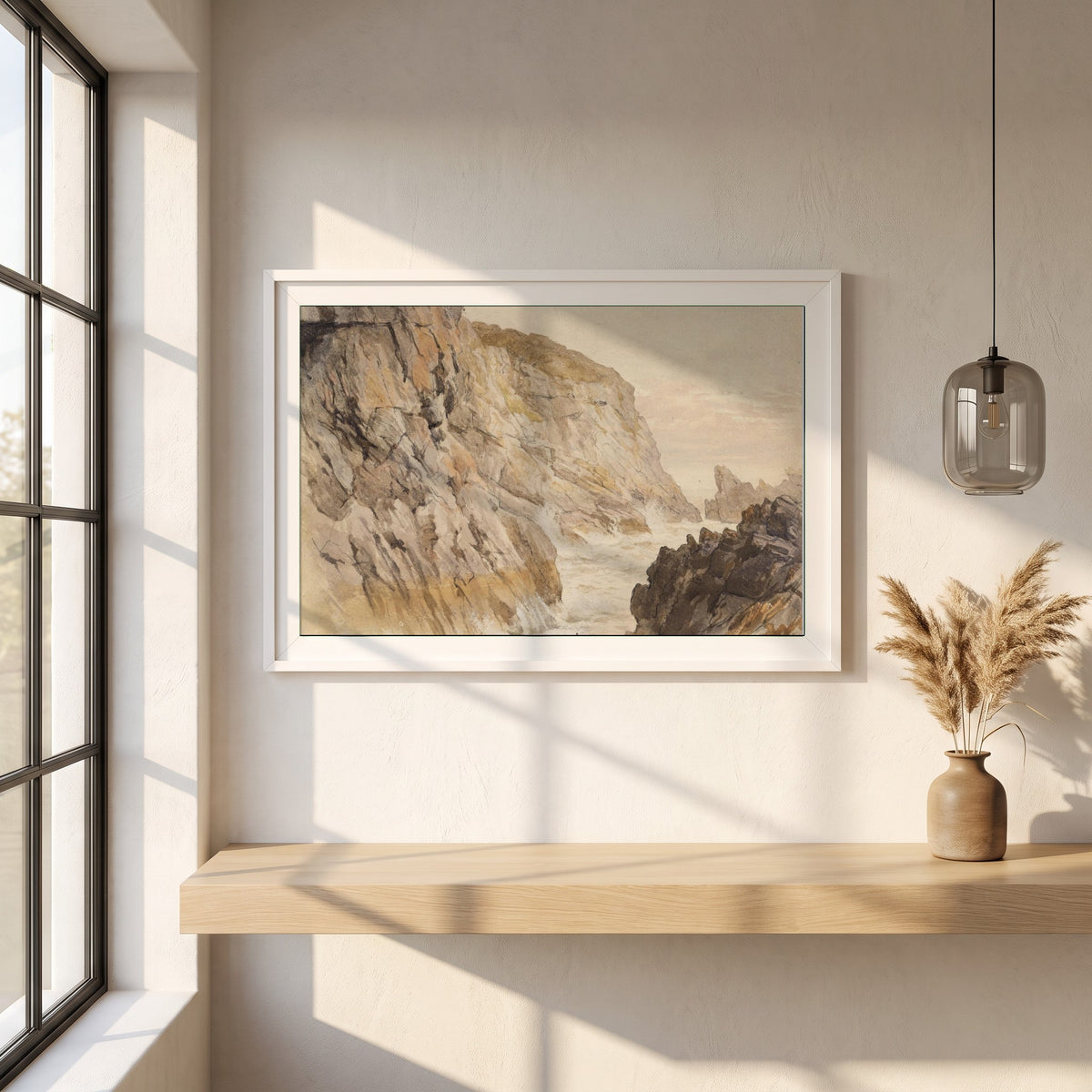 Cliffs at Howth, Dublin framed print in a white frame on a plaster wall above an oak worktop in a bright Scandinavian kitchen