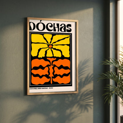 Dóchas framed print in a natural oak frame on a dark green wall beside a window, dappled plant shadow