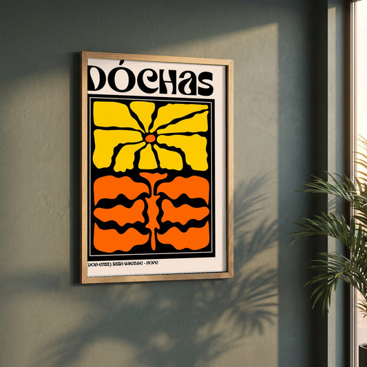 Dóchas framed print in a natural oak frame on a dark green wall beside a window, dappled plant shadow
