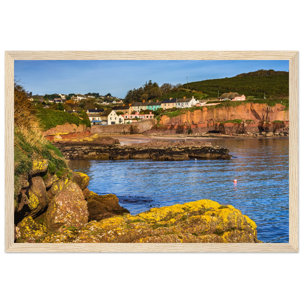 Dunmore East photographic landscape print in a natural wood frame