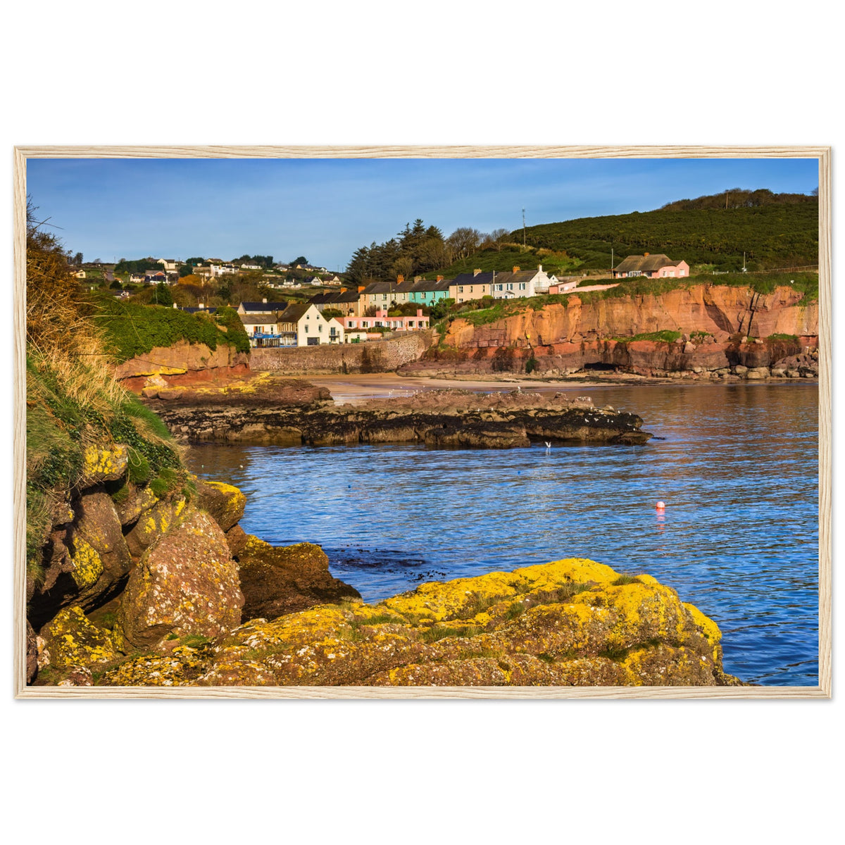 Dunmore East photographic print in a light oak frame, white cottages above the bay