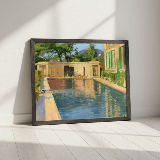 Lavery swimming pool print in a black frame leaning on a white wall in diagonal sunlight