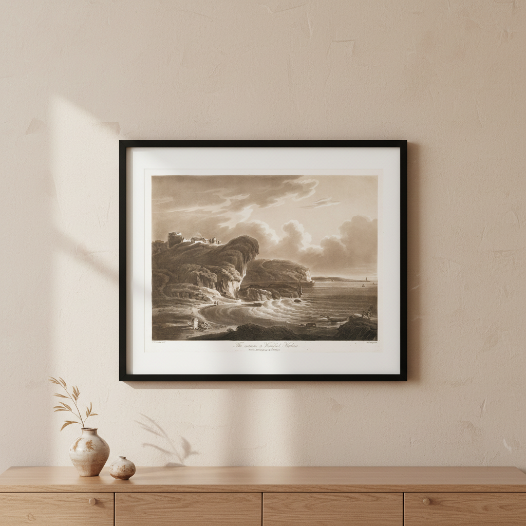 The Entrance to Waterford Harbour aquatint in a black frame with white mount above an oak sideboard