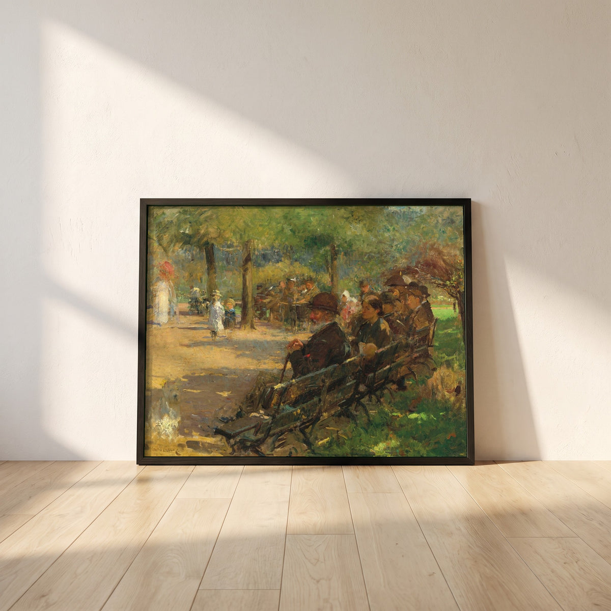 In a Dublin Park, Light and Shade framed print in a black frame leaning against a white plaster wall on oak floorboards in morning light