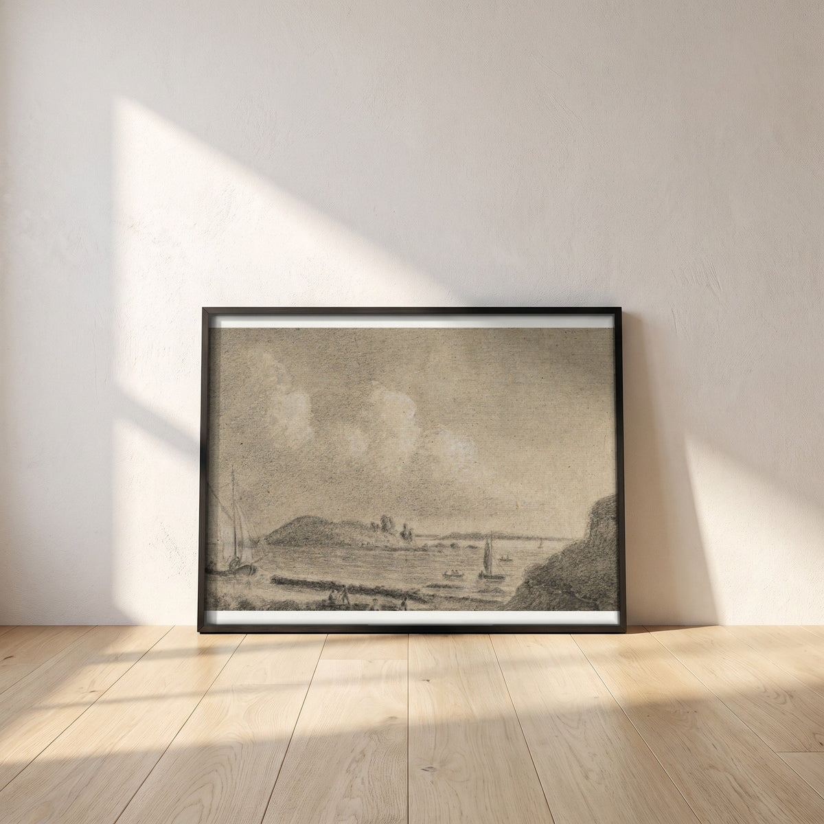 Ireland's Eye and Lambay Island from Howth framed print in a black frame leaning against a white plaster wall on oak floorboards in morning light
