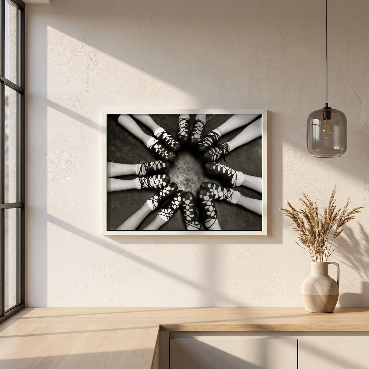 Irish Dancing Shoes Black & White framed print in a white frame on a plaster wall above an oak worktop in a bright Scandinavian kitchen