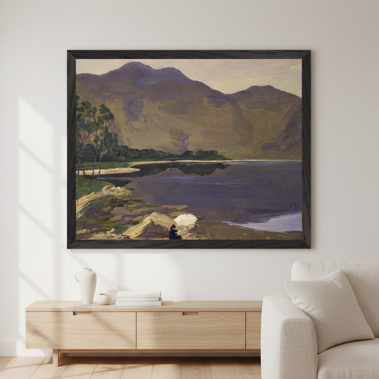 Loch Katrine by Sir John Lavery in a black frame above a low oak sideboard and white armchair