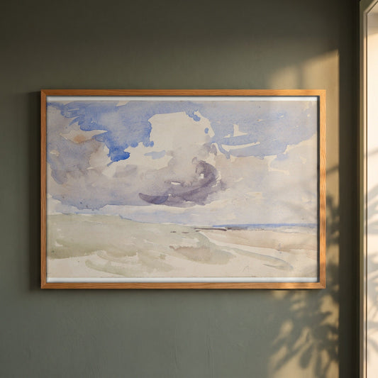 Low Clouds over a Beach framed print in a natural oak frame on a dark green wall beside a window, dappled plant shadow