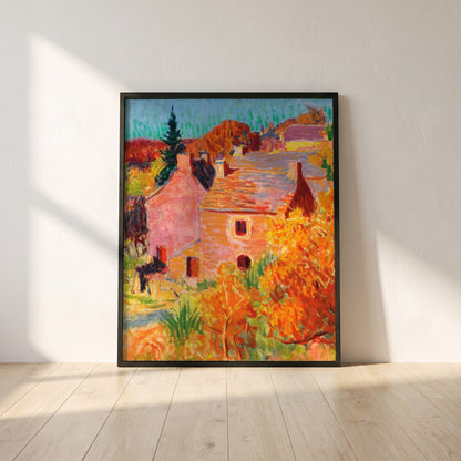 Maisons Rouges à Pont-Aven framed print in a black frame leaning against a white plaster wall on oak floorboards in morning light