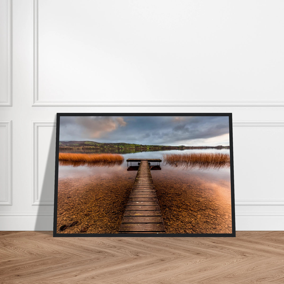 Old Jetty, Lough Derg print in a black frame with a white border on a herringbone floor