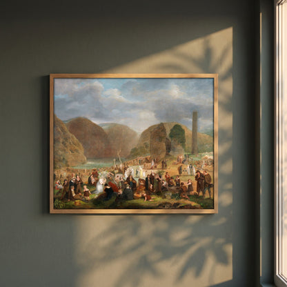 Patron's Day at the Seven Churches, Glendalough (c.1816) framed print in a natural oak frame on a dark green wall beside a window, dappled plant shadow