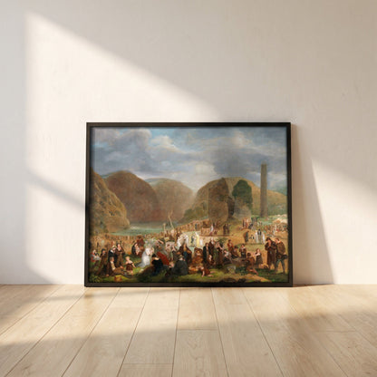 Patron's Day at the Seven Churches, Glendalough (c.1816) framed print in a black frame leaning against a white plaster wall on oak floorboards in morning light