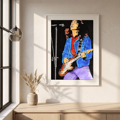 Rory Gallagher framed print in a white frame on a plaster wall above an oak worktop in a bright Scandinavian kitchen