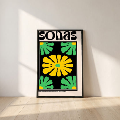 Sonas framed print in a black frame leaning against a white plaster wall on oak floorboards in morning light