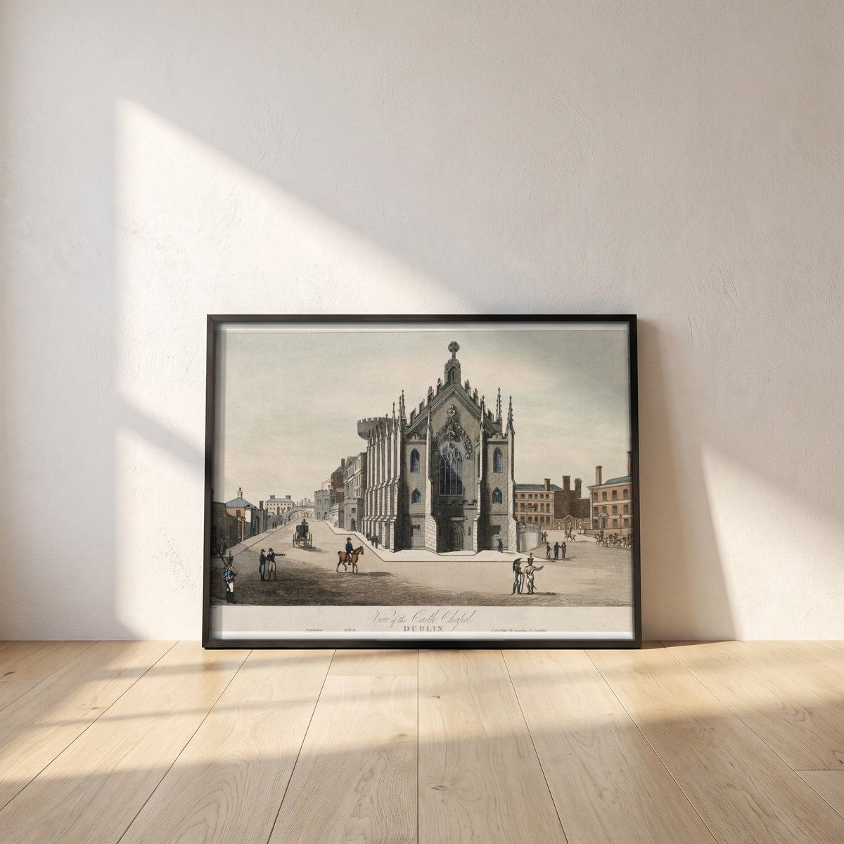 The Chapel Royal, Dublin Castle framed print in a black frame leaning against a white plaster wall on oak floorboards in morning light