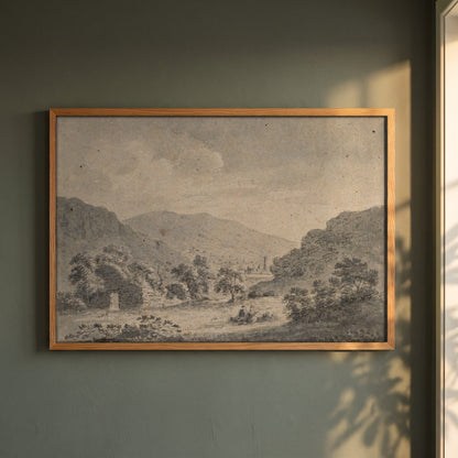 The Round Tower, Glendalough, from Temple-na-Skellig framed print in a natural oak frame on a dark green wall beside a window, dappled plant shadow