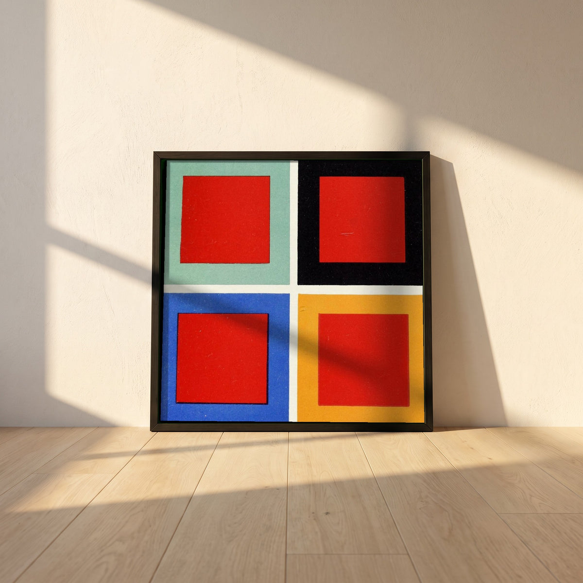 Tone and Hue framed print in a black frame leaning against a white plaster wall on oak floorboards in morning light