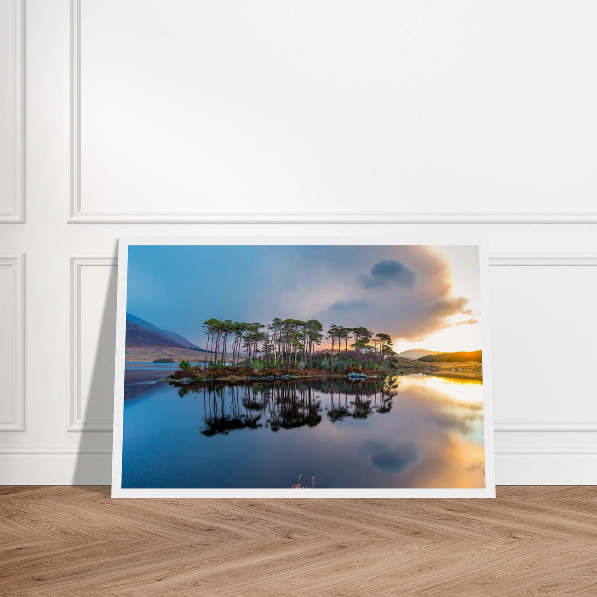 Twelve Pines, Derryclare Lough print in a white frame leaning against a panelled wall