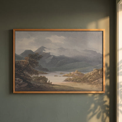 View on the Upper Lake, Killarney framed print in a natural oak frame on a dark green wall beside a window, dappled plant shadow