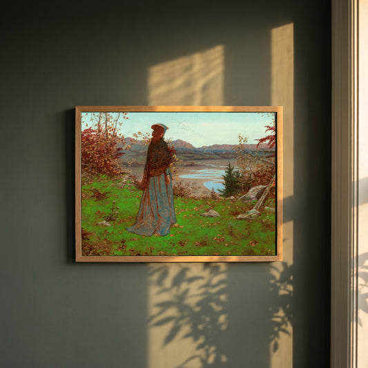 William Hennessy framed print in a natural oak frame on a dark green wall beside a window, dappled plant shadow
