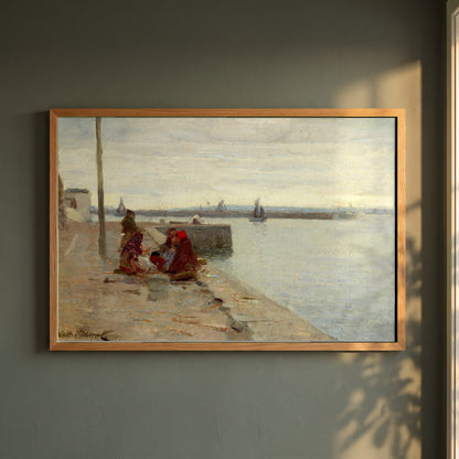 Women on a Galway Quayside framed print in a natural oak frame on a dark green wall beside a window, dappled plant shadow